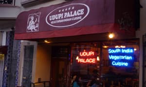 Evening storefront of Udupi Palace on Valencia Street in San Francisco's Mission District
