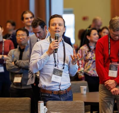 Martin Borch Jensen speaking from the audience at the 2025 Genetic Agency and Technology Conference