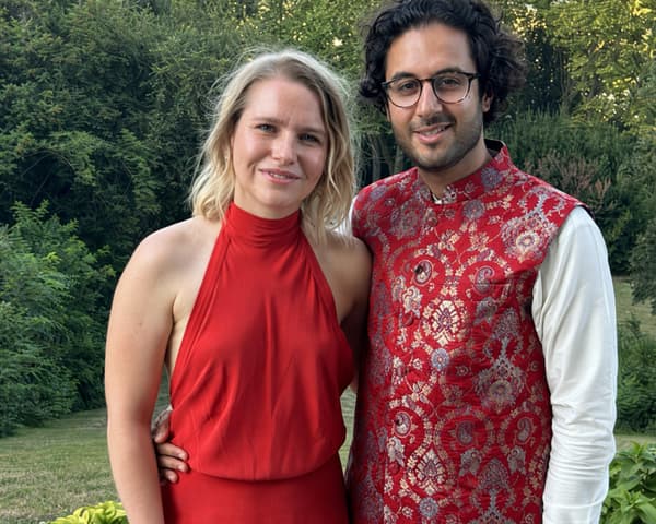 Raza Habib and Alex Page standing together in a garden